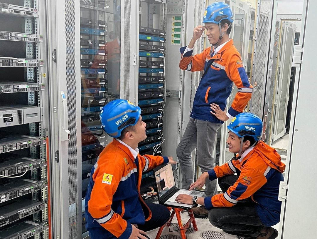 Engineers working on substation equipment